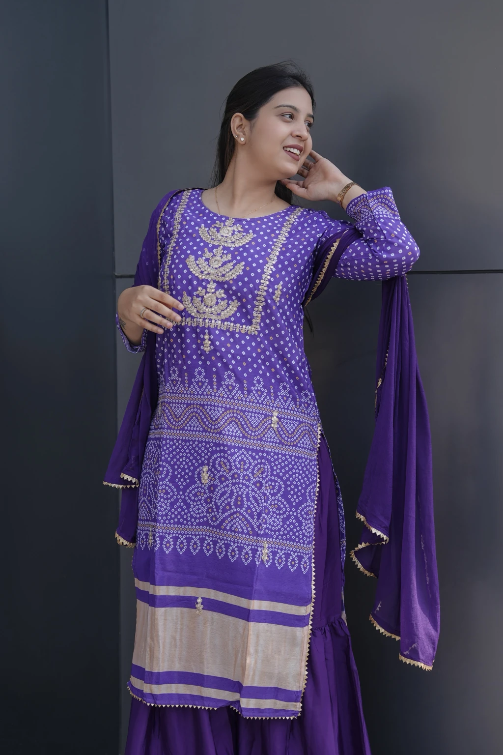 This is a beautiful and elegant Chinon Kurta Set in a rich purple hue